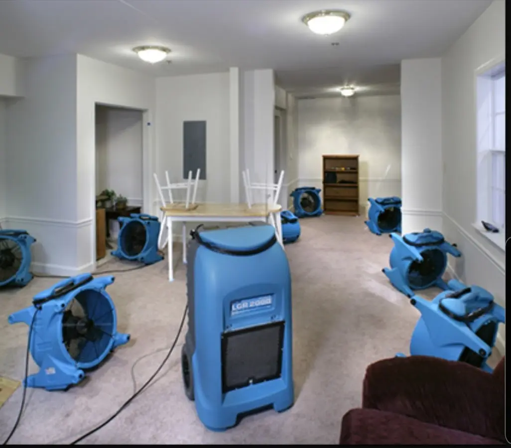 Air movers and dehumidifier setup for Water Damage Restoration in Newton
